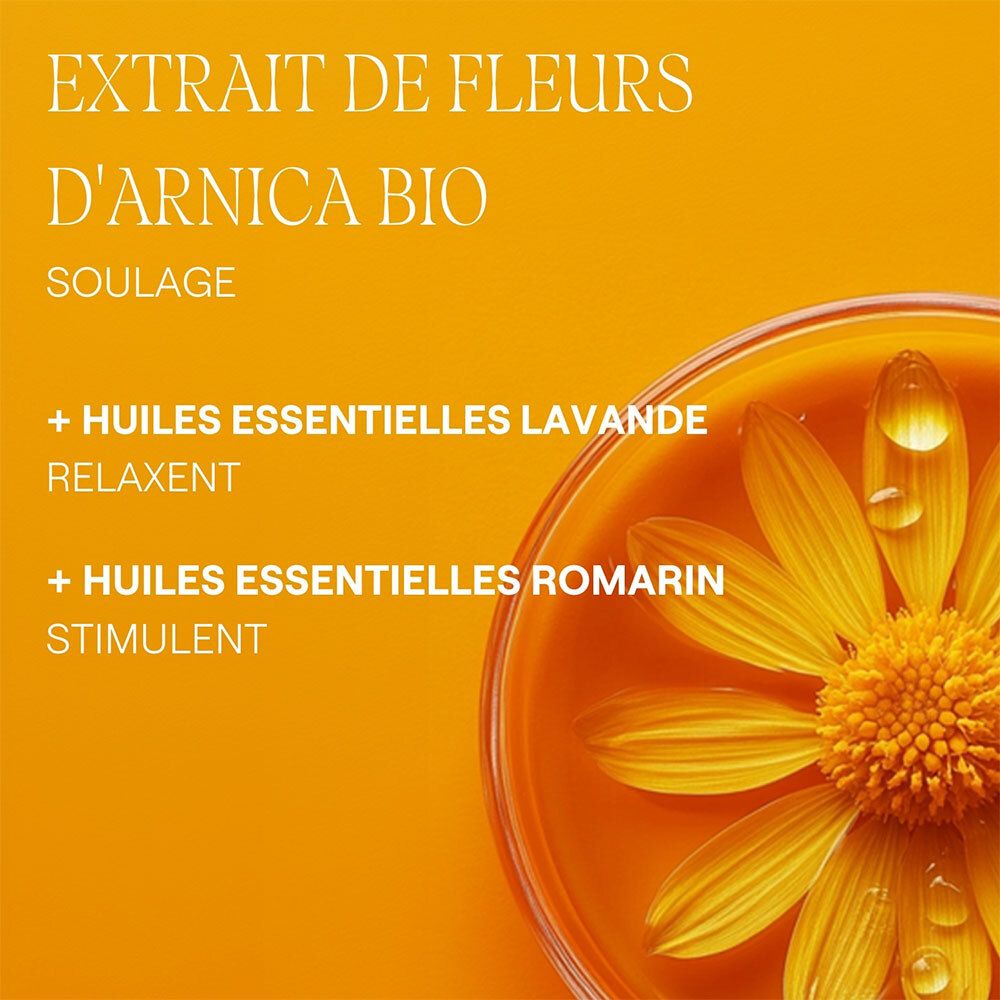 Gros plan sur des fleurs jaunes dans un liquide. Texte: Extrait de fleurs d'arnica, huiles essentielles.