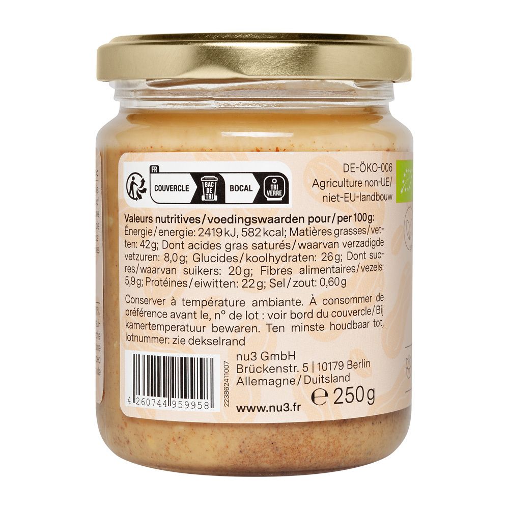 Dos du pot de beurre de cacahuètes. Valeurs nutritionnelles, date limite, adresse fabricant, logo bio.