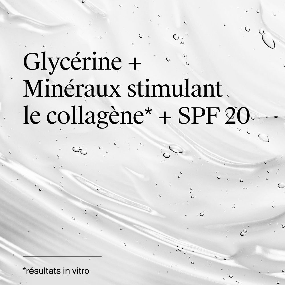 Gros plan sur une texture de crème. Contient de la glycérine, des minéraux et SPF 20. Texture brillante.
