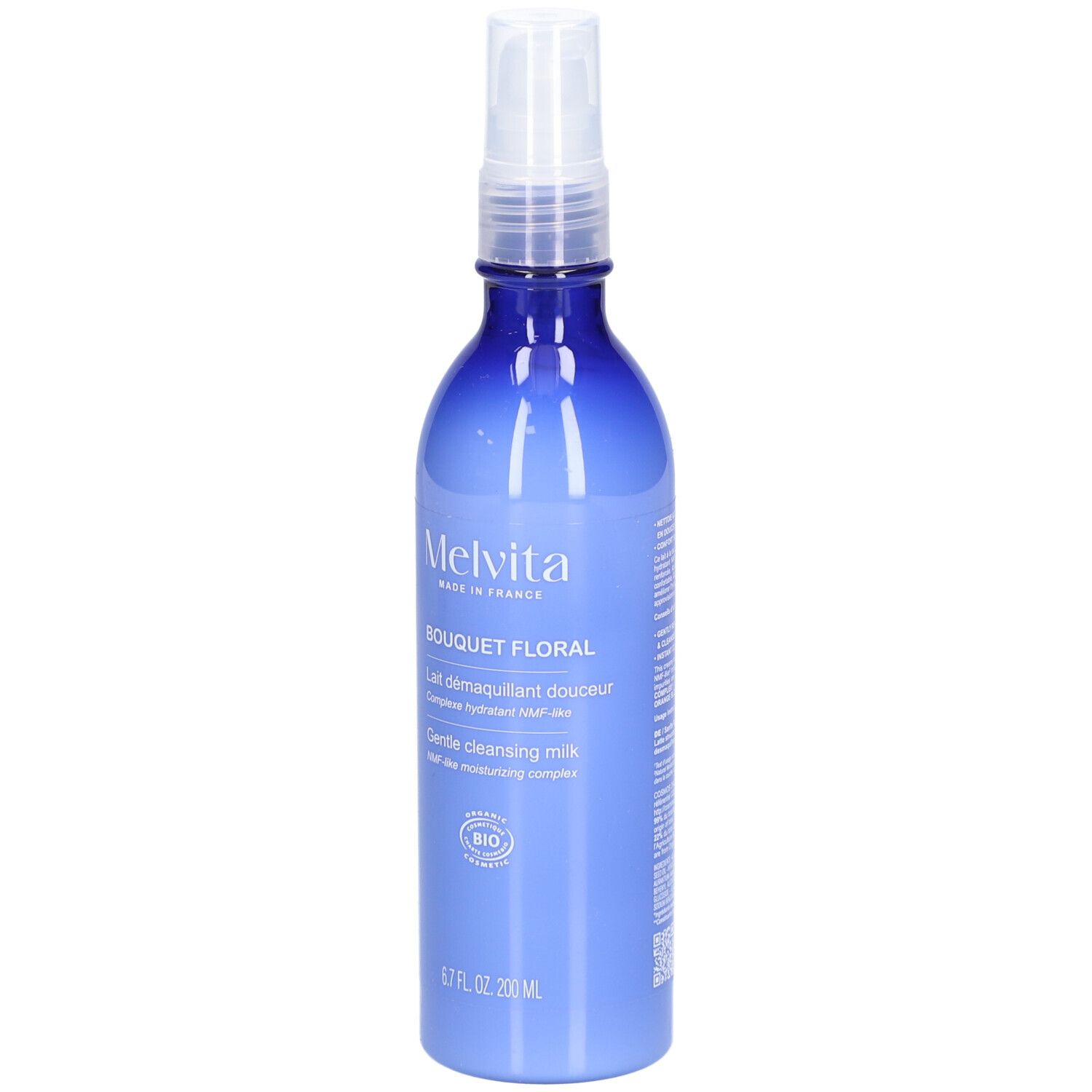 Flacon bleu transparent avec vaporisateur. Inscription: MELVITA, Bouquet Floral, Gentle cleansing milk, label BIO.