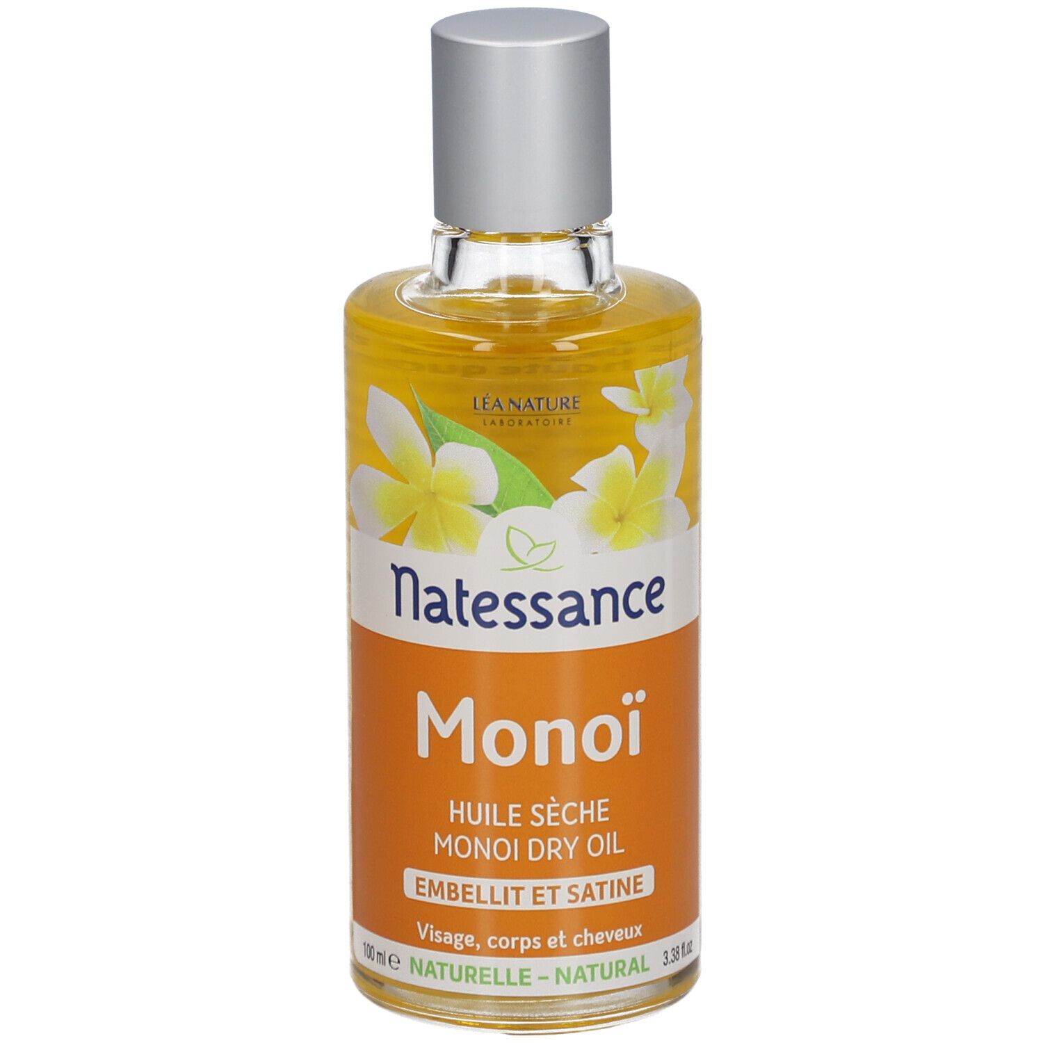 Flacon d'huile sèche Monoï Natessance. Étiquette orange avec fleurs blanches. Bouchon argenté.