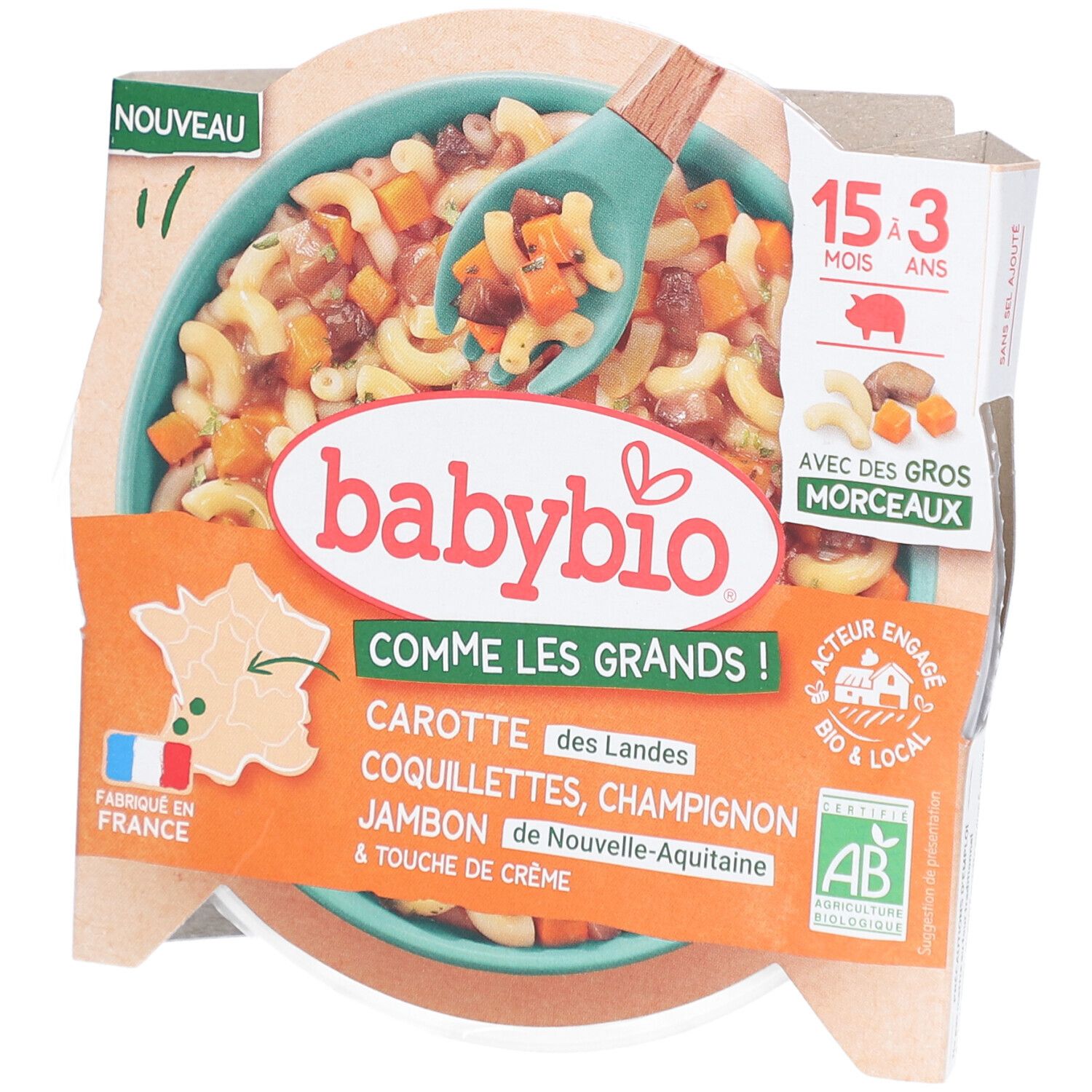 Plat préparé pour bébé Babybio. Contient carottes, coquillettes, champignons, jambon et crème. Emballage avec cuillère.