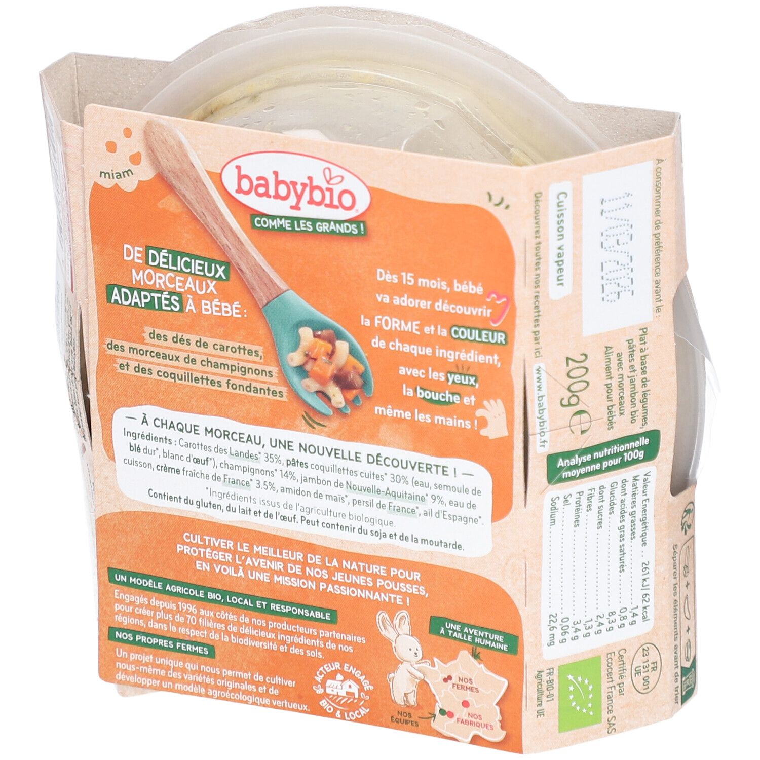 Dos du plat préparé Babybio. Contient carottes, coquillettes, champignons, jambon et crème. Informations produit.