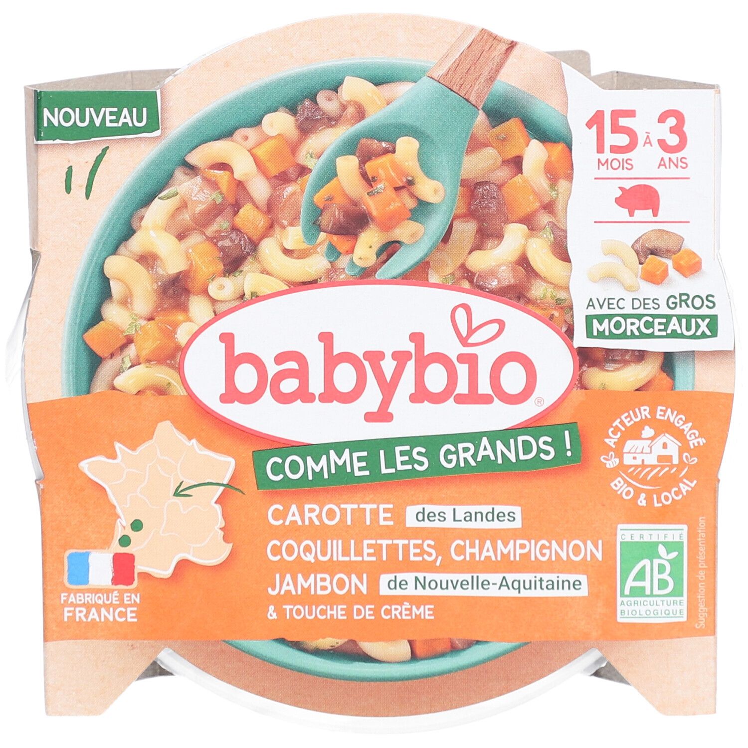 Plat préparé Babybio. Contient carottes, coquillettes, champignons, jambon et crème. Emballage avec cuillère.