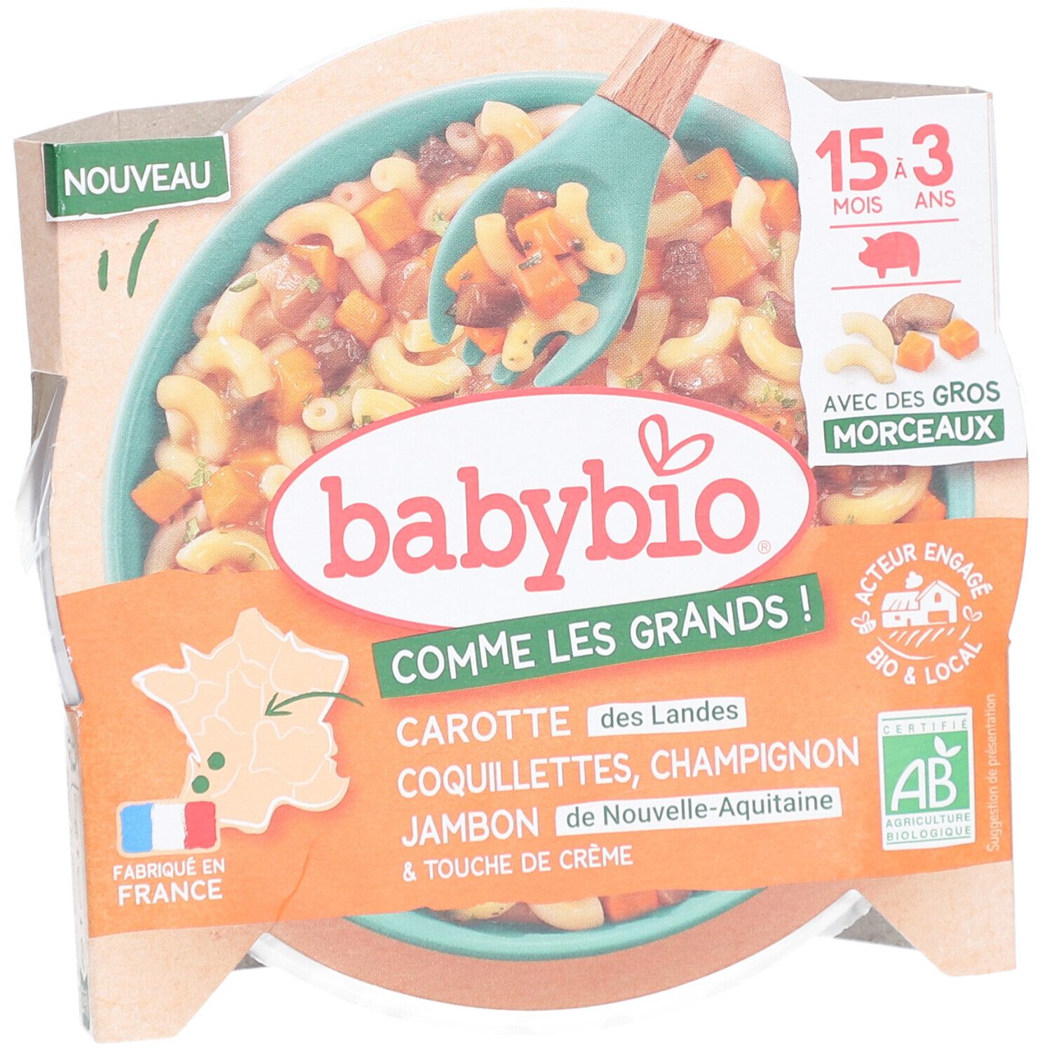 Plat préparé Babybio. Contient carottes, coquillettes, champignons, jambon et crème. Emballage avec cuillère.