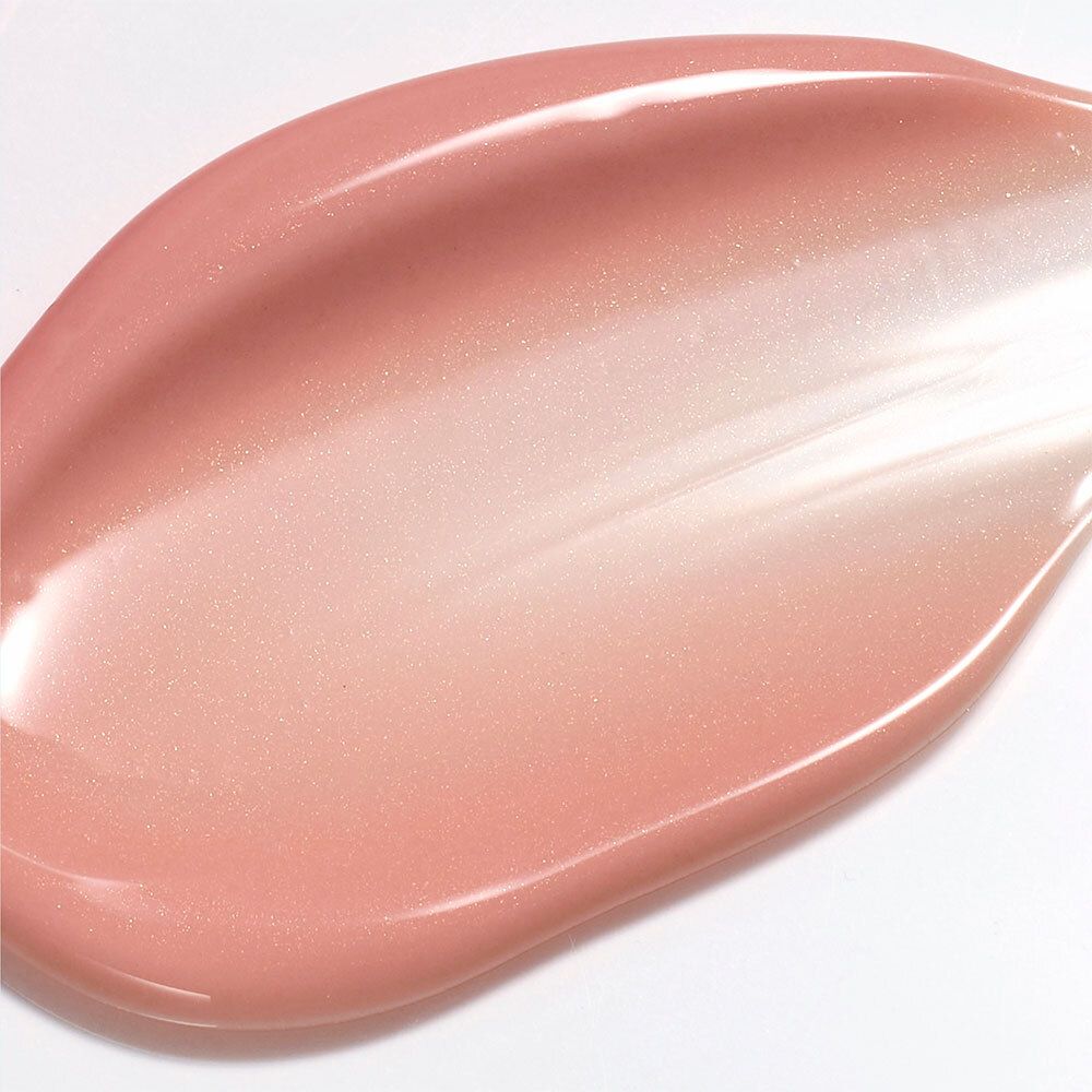 Texture de crème rose et chatoyante sur fond blanc.