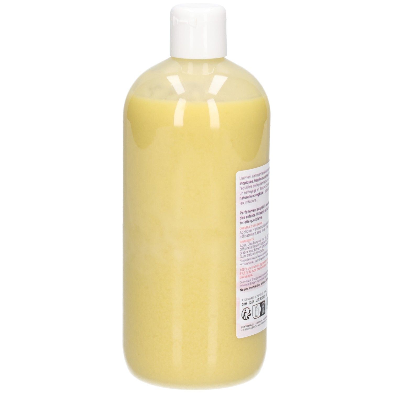 Côté d'un flacon de liniment jaune, bouchon blanc.