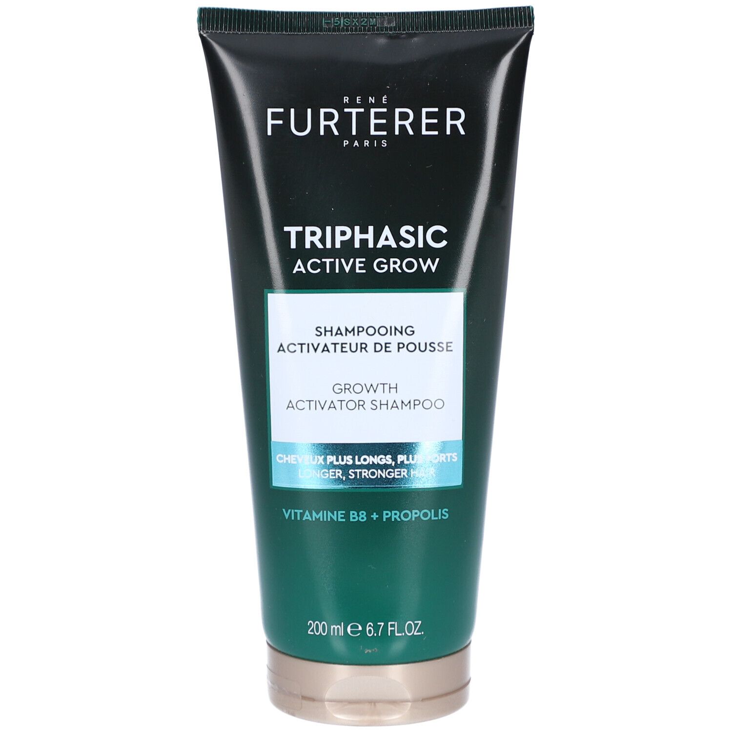 Tube vert foncé. Inscription: FURTERER, TRIPHASIC ACTIVE GROW, Shampooing. Texte: CHEVEUX PLUS LONGS, PLUS FORTS, VITA B8 + PROPOLIS.