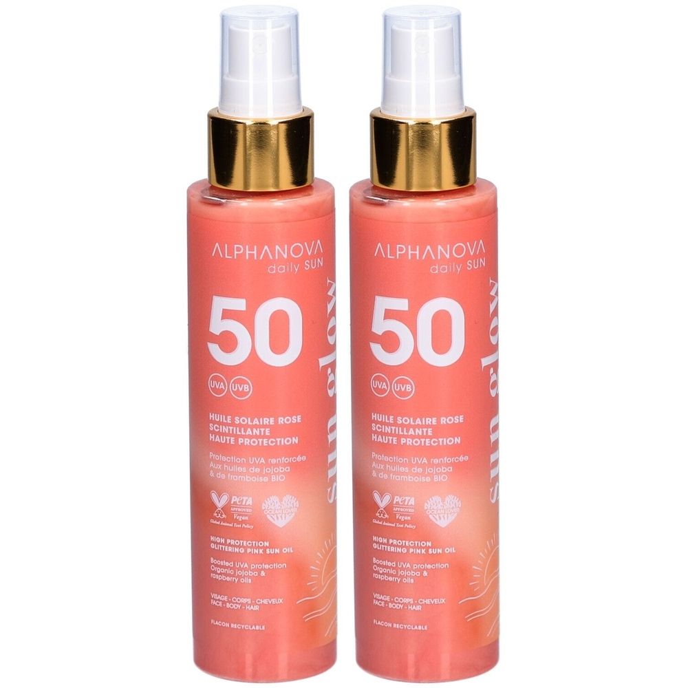Deux flacons d'Alphanova Huile Solaire Rose Scintillante SPF 50 avec spray et bague dorée. Haute protection UVA/UVB.