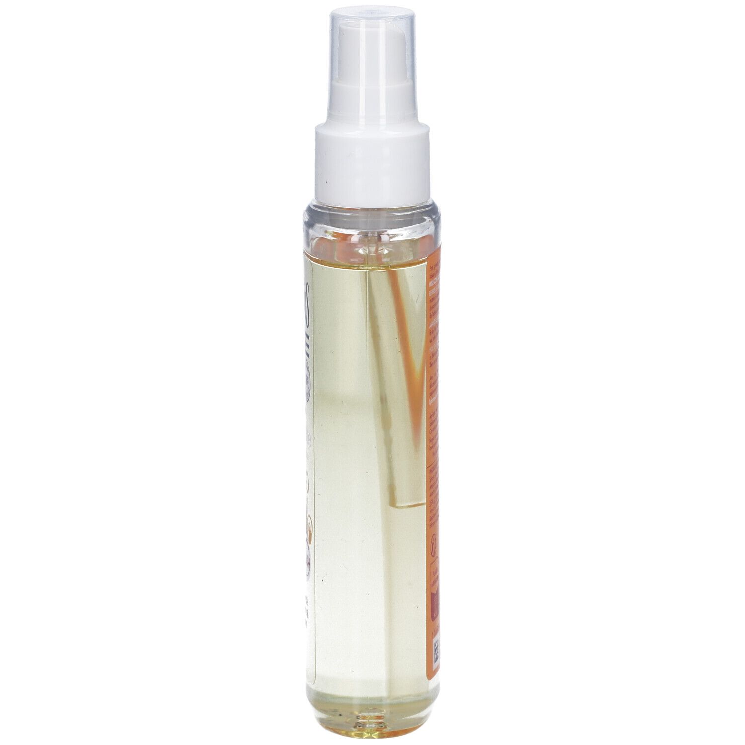 Flacon spray d'huile pour le corps, vue latérale. Verre transparent avec informations produit sur l'étiquette.