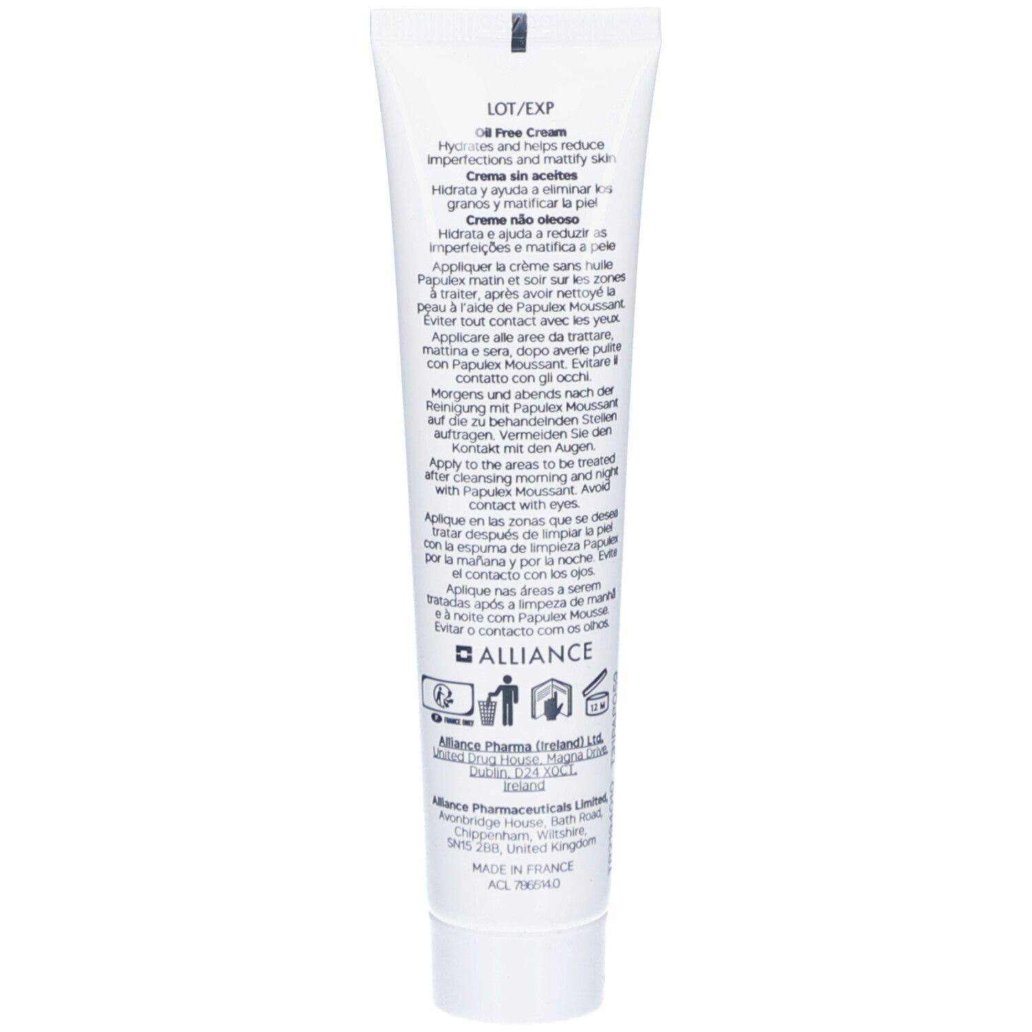 Dos d'un tube blanc. Texte multilingue. Informations fabricant et symboles.