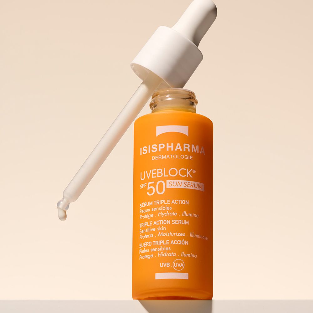 Flacon orange avec pipette. ISISPHARMA Uveblock SPF 50+ Sun Serum.