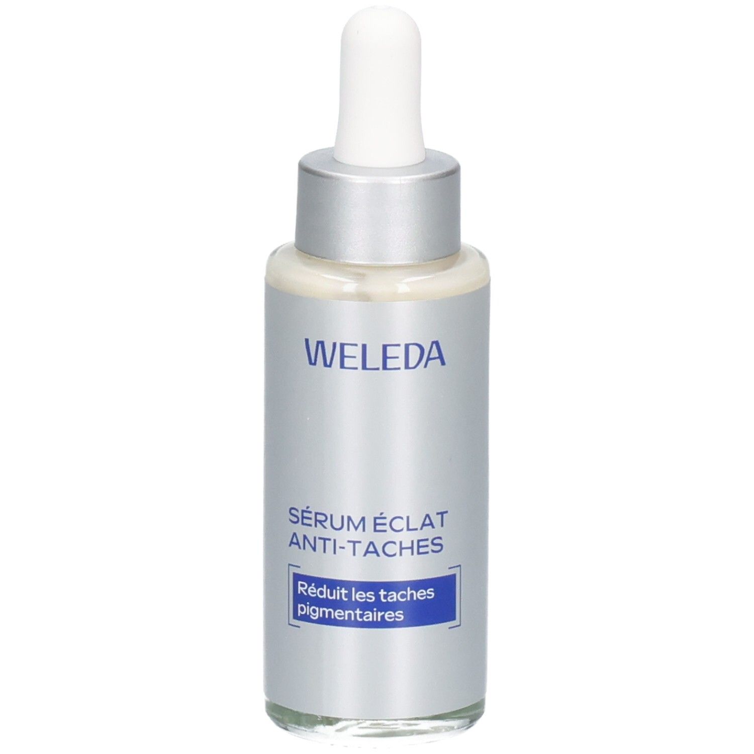 Flacon argenté avec bouchon blanc et pipette. Inscription : WELEDA, Sérum éclat anti-taches. Texte bleu : Réduit les taches pigmentaires.