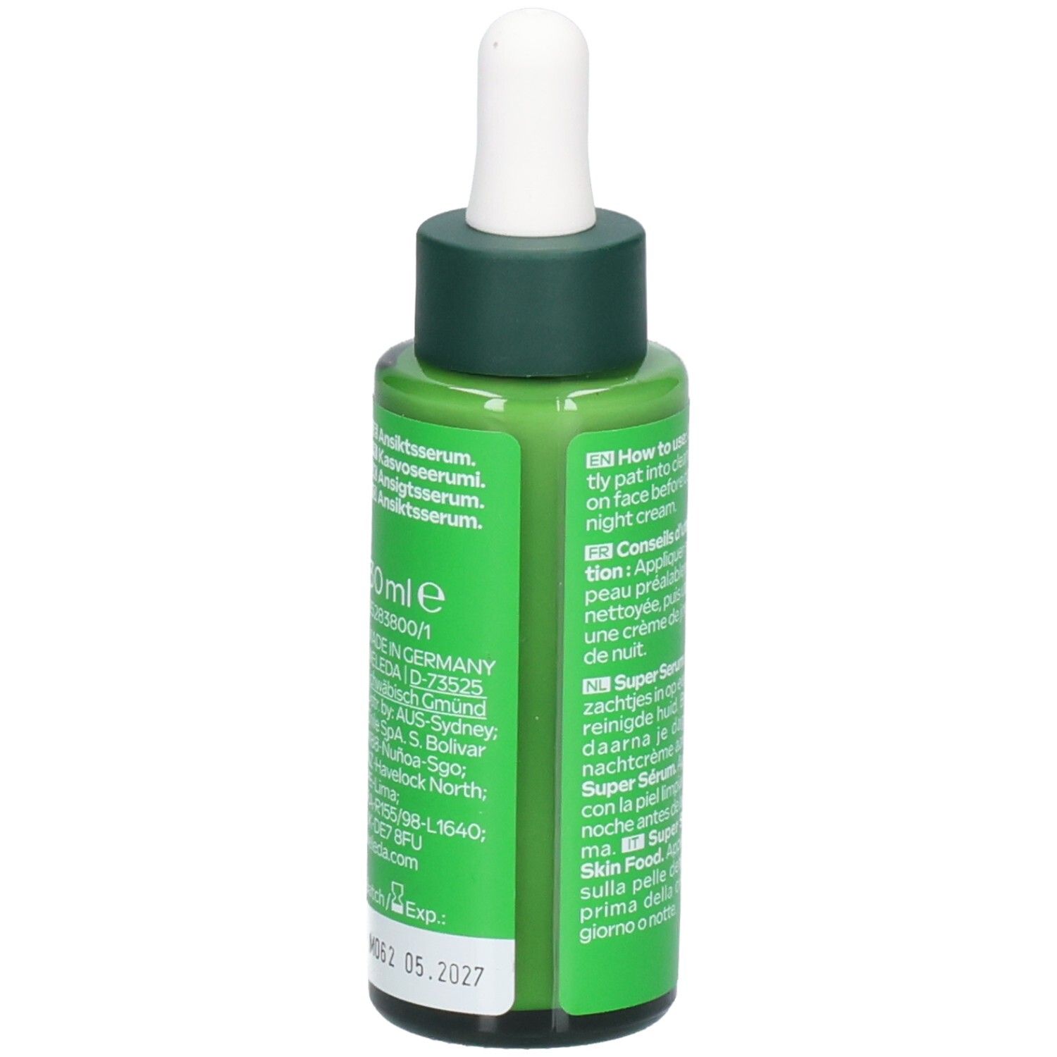 Flacon vert avec compte-gouttes blanc. Inscription: WELEDA, Skin Food Super Serum. 30 ml. Date de péremption.