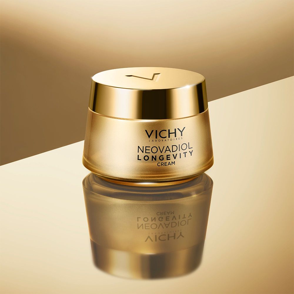 Pot doré. Inscription: VICHY, NEOVADIOL LONGEVITY CREAM. Reflet.