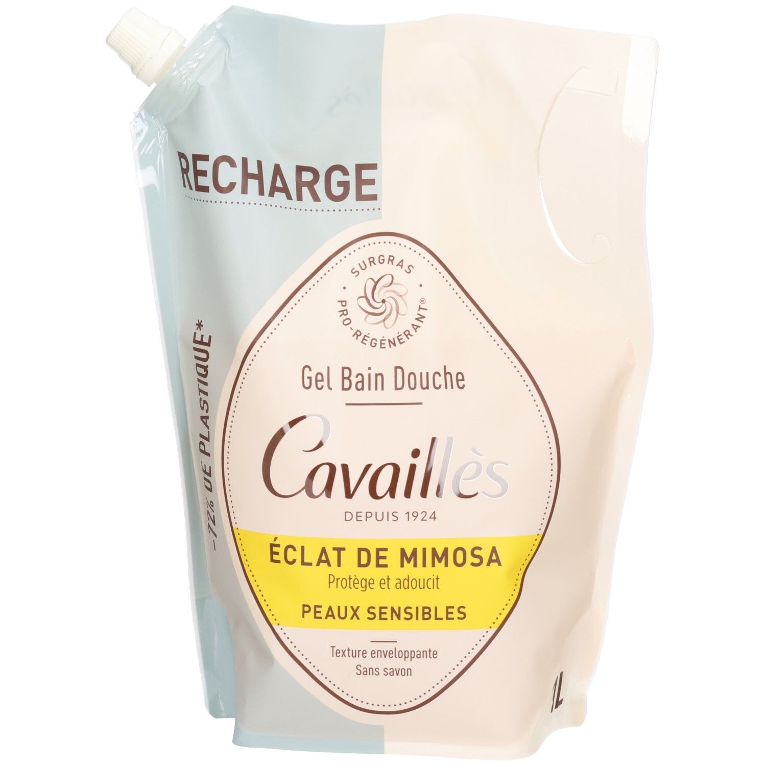 Recharge de gel douche. Emballage blanc et bleu. Texte: ÉCLAT DE MIMOSA, PEAUX SENSIBLES. Logo et nom de la marque visibles.
