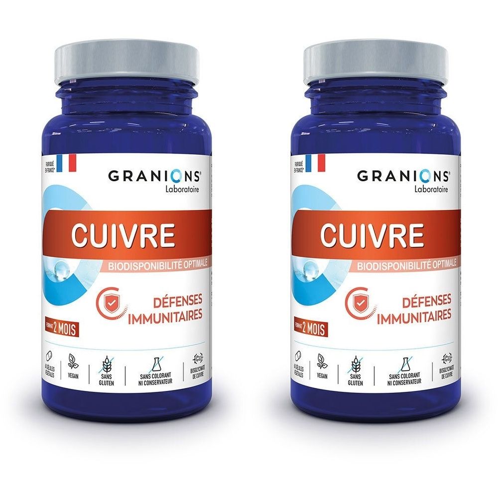 Deux flacons bleus avec bouchons blancs. Inscription: GRANIONS Cuivre, Défenses Immunitaires. Logos et texte en français.