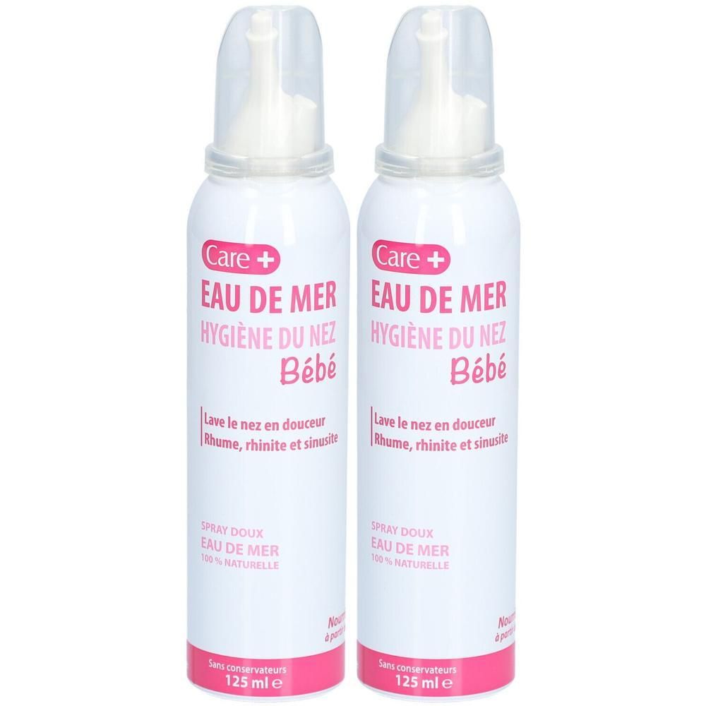 Deux flacons spray blancs avec étiquettes roses. Inscription: CARE+ Eau de mer Hygiène du nez Bébé.