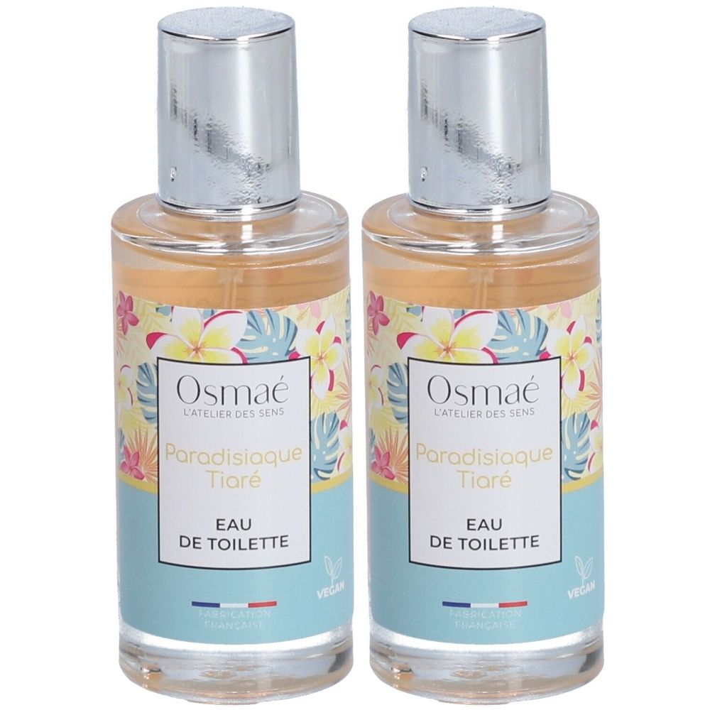 Deux flacons d'Osmaé Eau de toilette Paradisiaque Tiaré. Flacons transparents avec bouchons argentés et étiquette florale.
