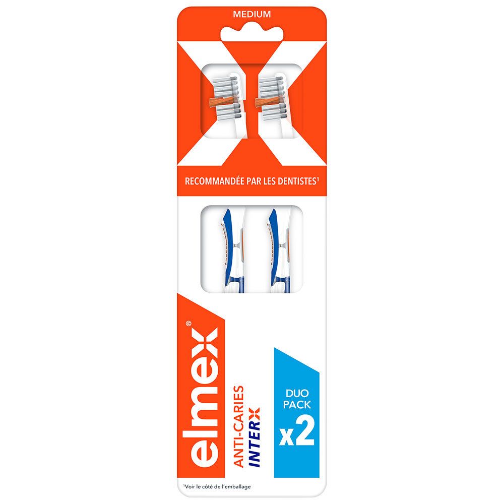Paquet de deux brosses à dents. Soies blanches, manche orange. "Medium" et "RECOMMANDÉE PAR LES DENTISTES" sur l'emballage.
