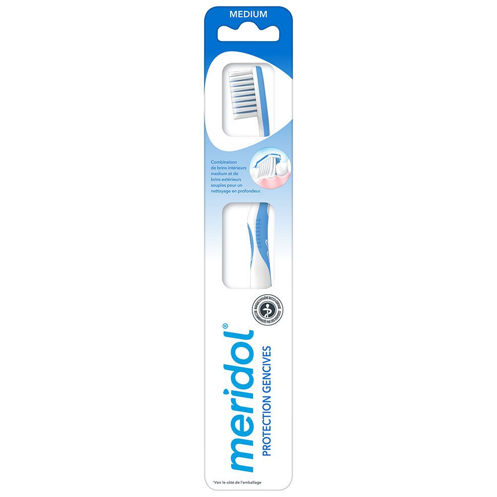 Brosse à dents bleue et blanche dans un emballage blister. Inscription "Meridol Protection Gencives".
