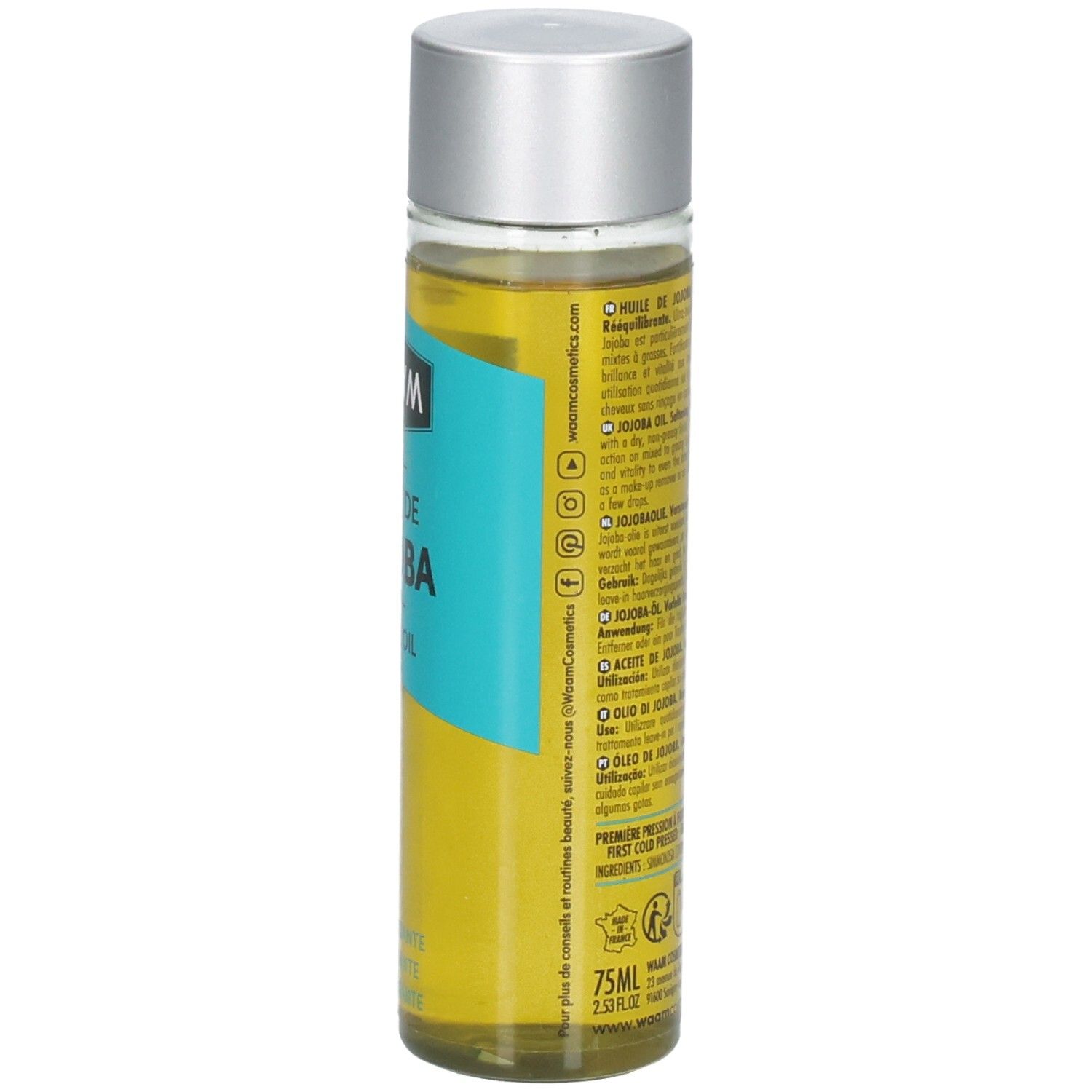 Waam Huile de Jojoba : flacon avec bouchon argenté et étiquette. Liquide doré dans un récipient transparent.
