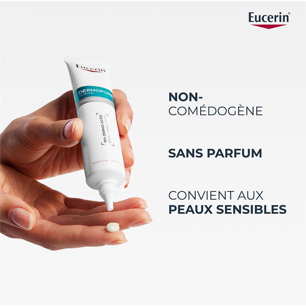Main tenant tube Eucerin Dermopure Clinical Peeling 10. Texte: Non comédogène, sans parfum, peaux sensibles. Logo Eucerin.
