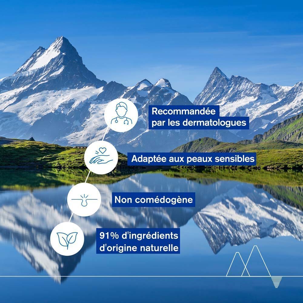 Paysage avec montagnes. Texte : Recommandée par les dermatologues, Adaptée aux peaux sensibles.