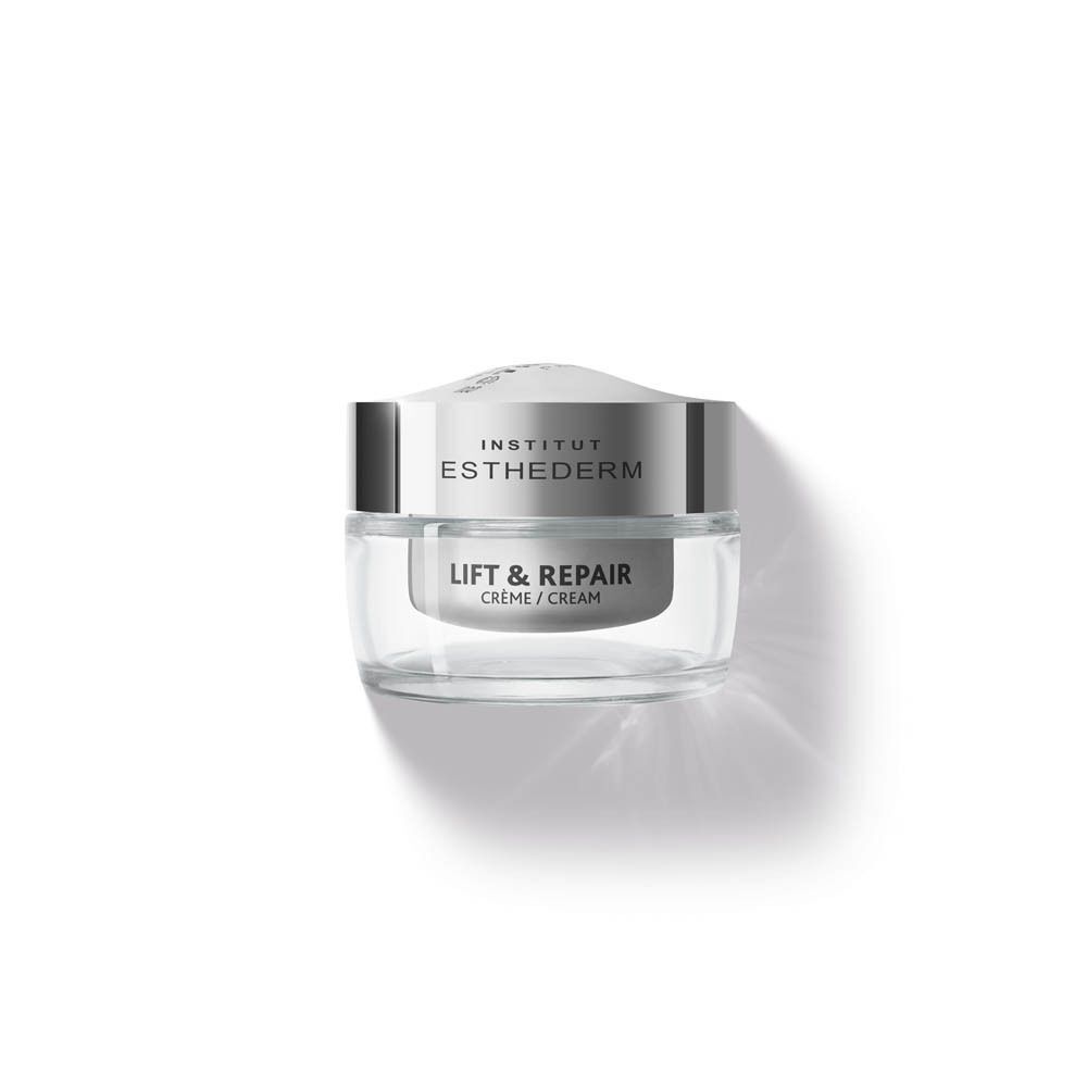 Un pot de crème Institut Esthederm Lift & Repair. Récipient en verre avec couvercle argenté. Texte : Lift & Repair, Crème/Cream.
