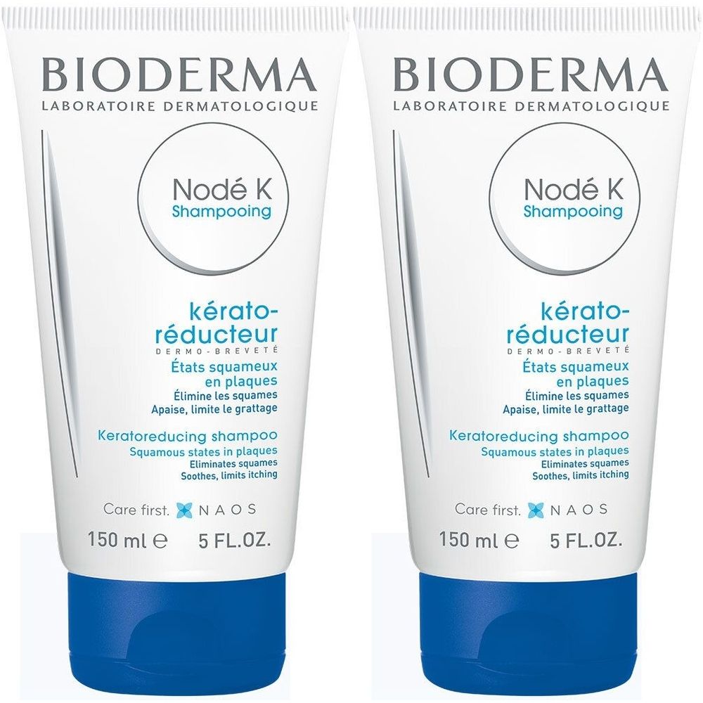 Deux tubes de shampooing BIODERMA Nodé K. Blanc, bouchon bleu. Texte : kérato-réducteur, 150 ml, 5 FL.OZ.