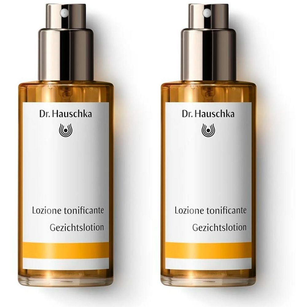 Deux flacons avec vaporisateur. Inscription : Dr. Hauschka, Lozione tonificante, Gesichtslotion. Étiquettes jaunes et blanches.