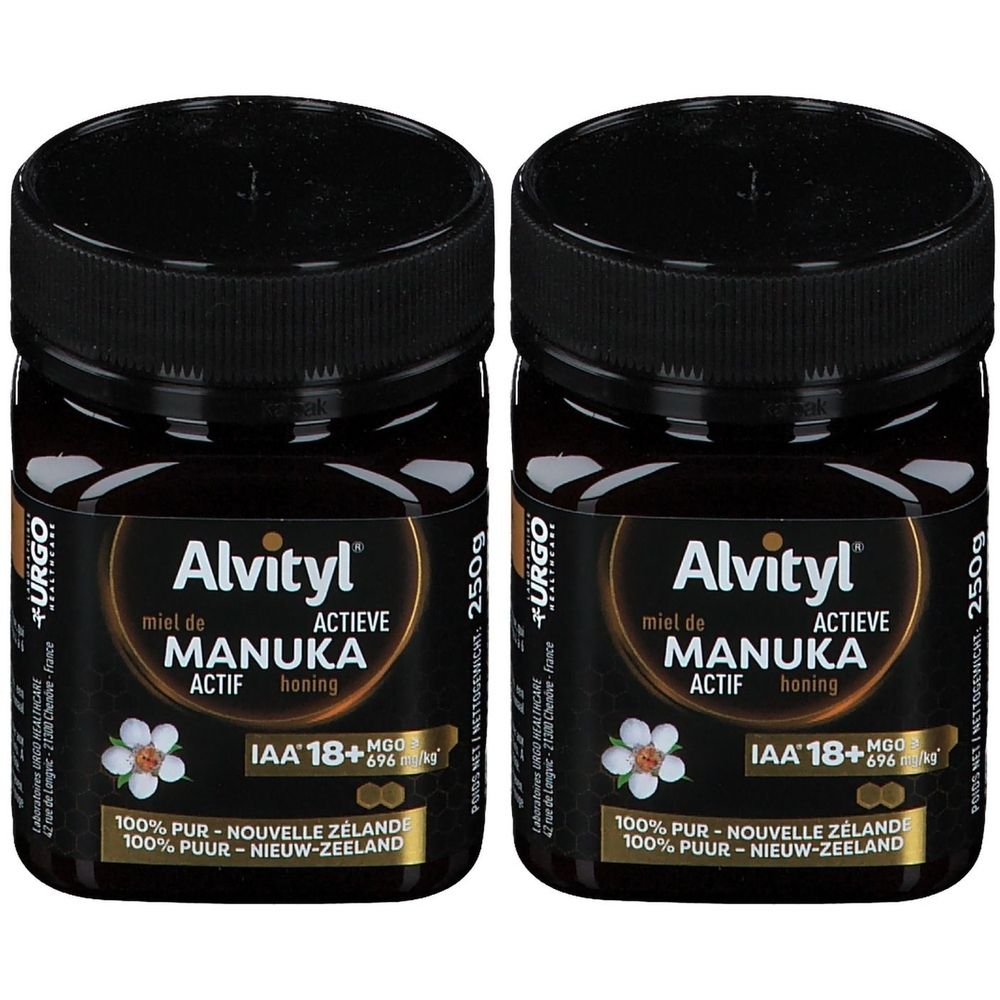 Deux pots de miel Alvityl Miel de Manuka ACTIF IAA 18+. Pots noirs avec couvercles noirs. Étiquette avec informations et fleur.