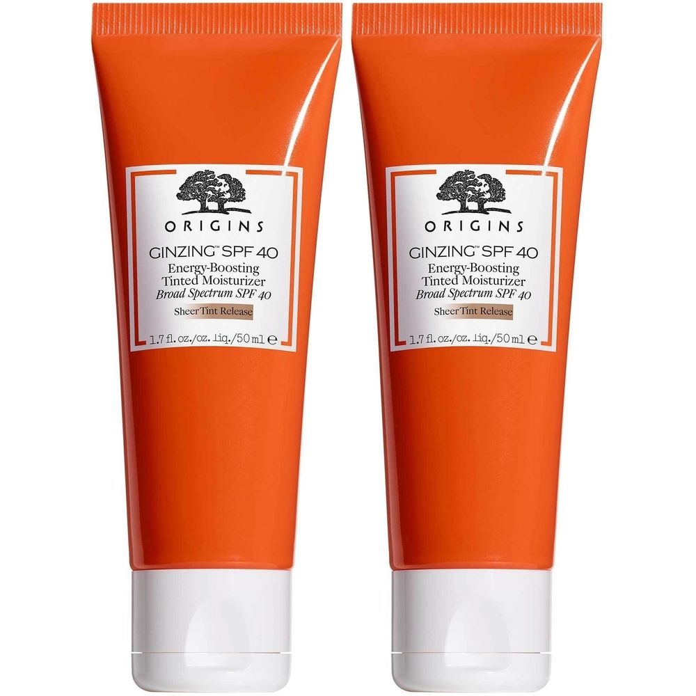 Deux tubes de Origins GinZing SPF 40. Tubes orange avec étiquette blanche. Texte : Energy-Boosting Tinted Moisturizer, Broad Spectrum SPF 40.