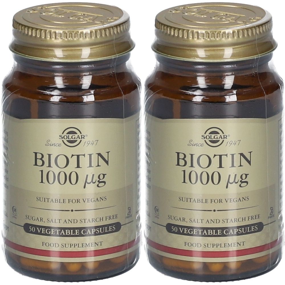Deux flacons de SOLGAR Biotine 1000 µg. Flacons en verre brun avec couvercles dorés. Inscription : Biotine 1000 µg, convient aux végétaliens, sans sucre, sel ni amidon.