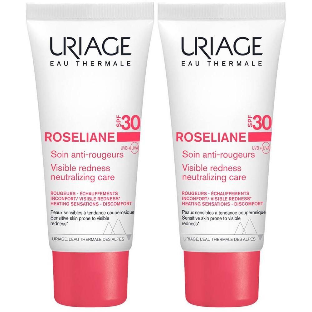 Deux tubes de crème Uriage Roséliane, blanc avec bouchon rouge. Texte: Roséliane, SPF30.