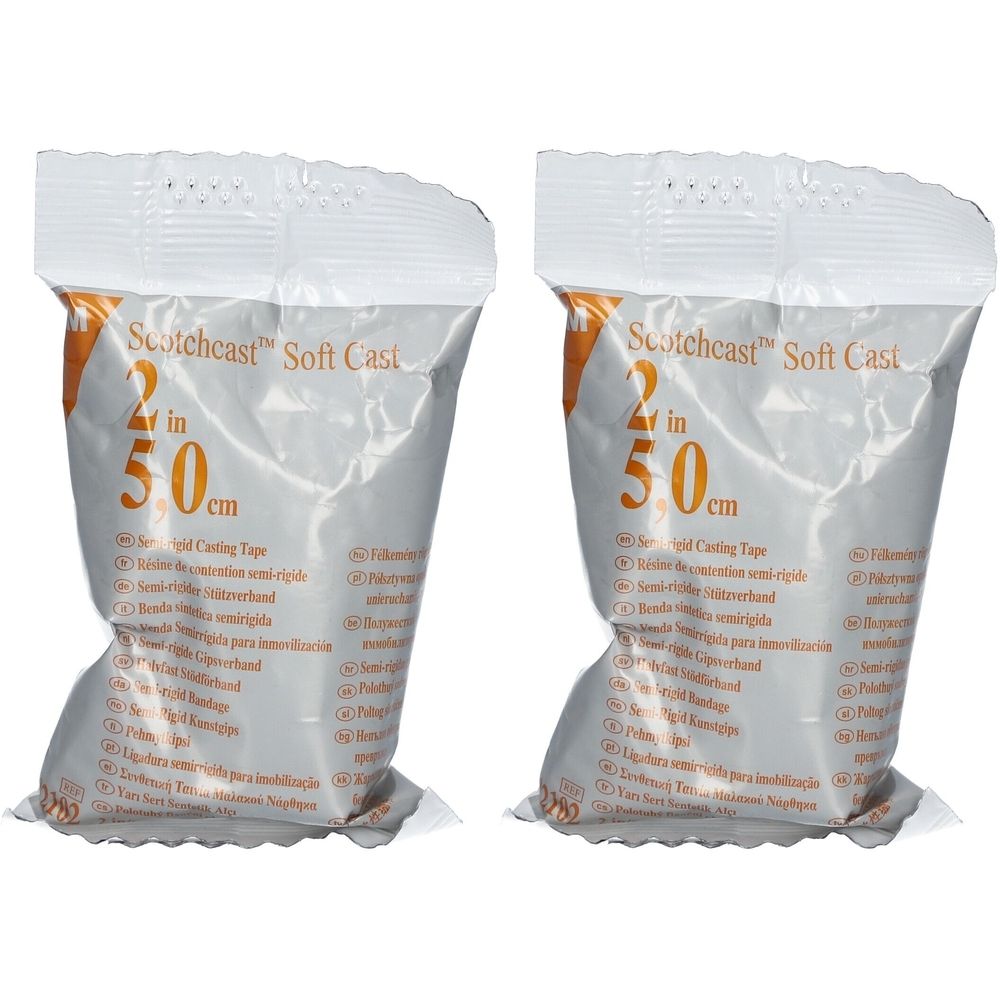 Deux emballages de Scotchcast Soft Cast. Inscription : 2 in 5,0 cm. Emballage avec fond blanc et accents orange.