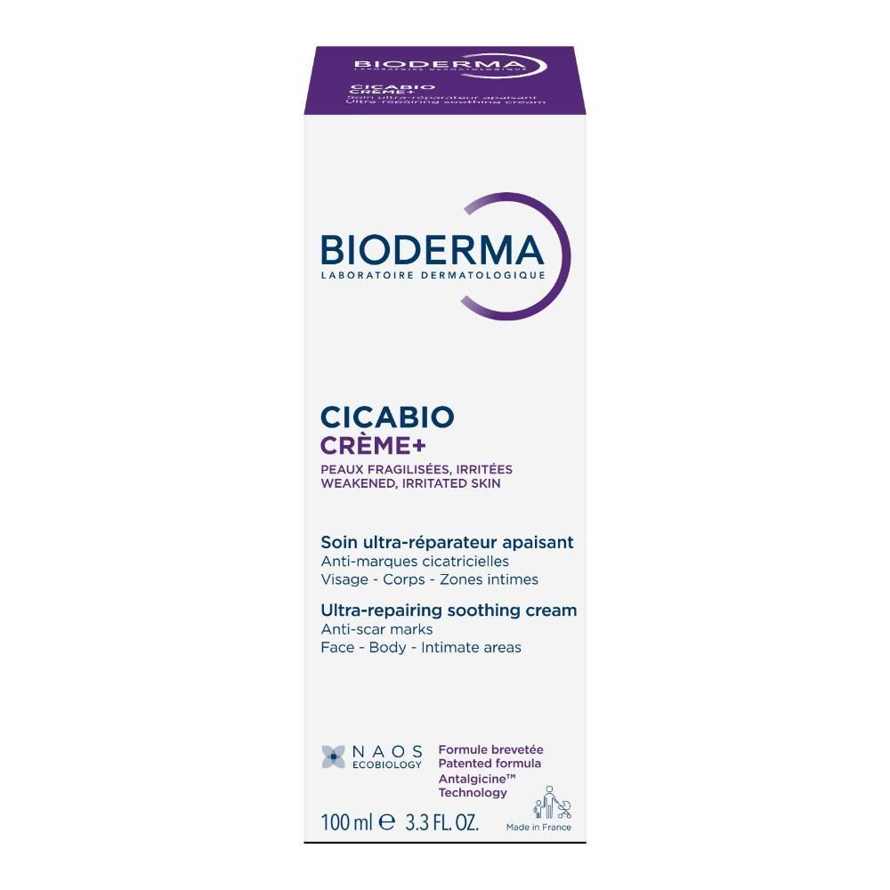 Dos du tube de crème. Texte multilingue. Bouchon violet. Fond blanc.