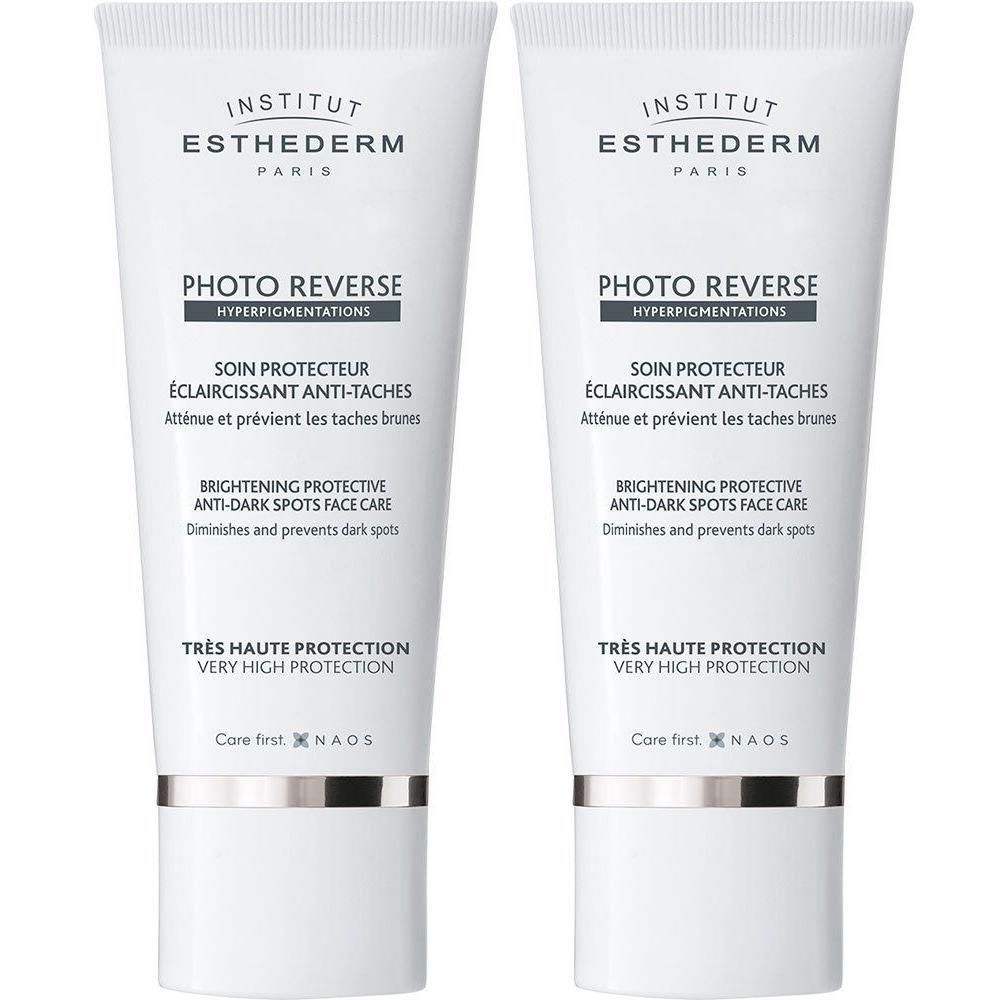 Deux tubes INSTITUT ESTHEDERM Photo Reverse. Blanc, texte et logo. "PHOTO REVERSE" et "SOIN PROTECTEUR".