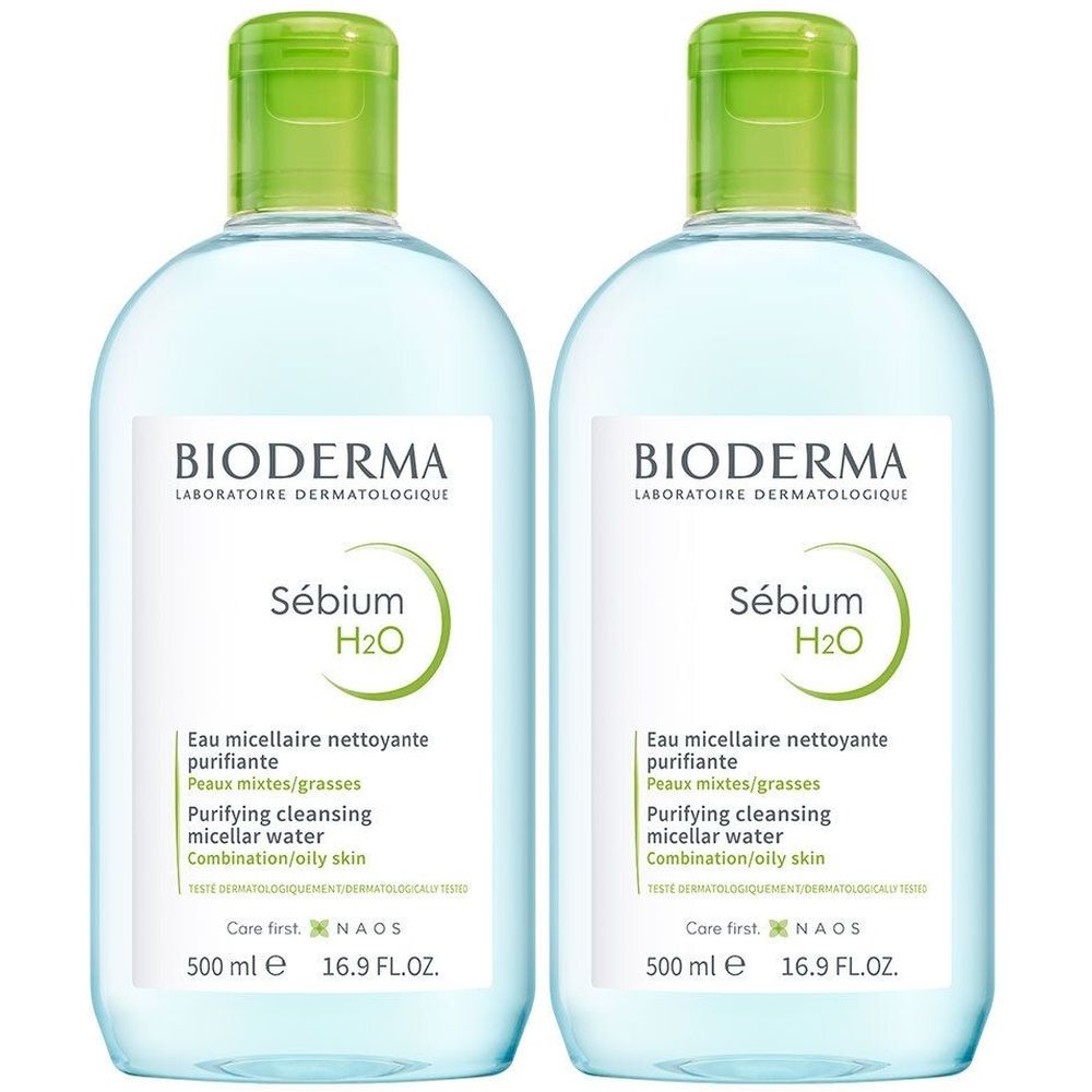 Deux flacons de Bioderma Sébium H2O. Liquide clair dans des bouteilles transparentes avec des bouchons verts. Étiquette avec informations produit.