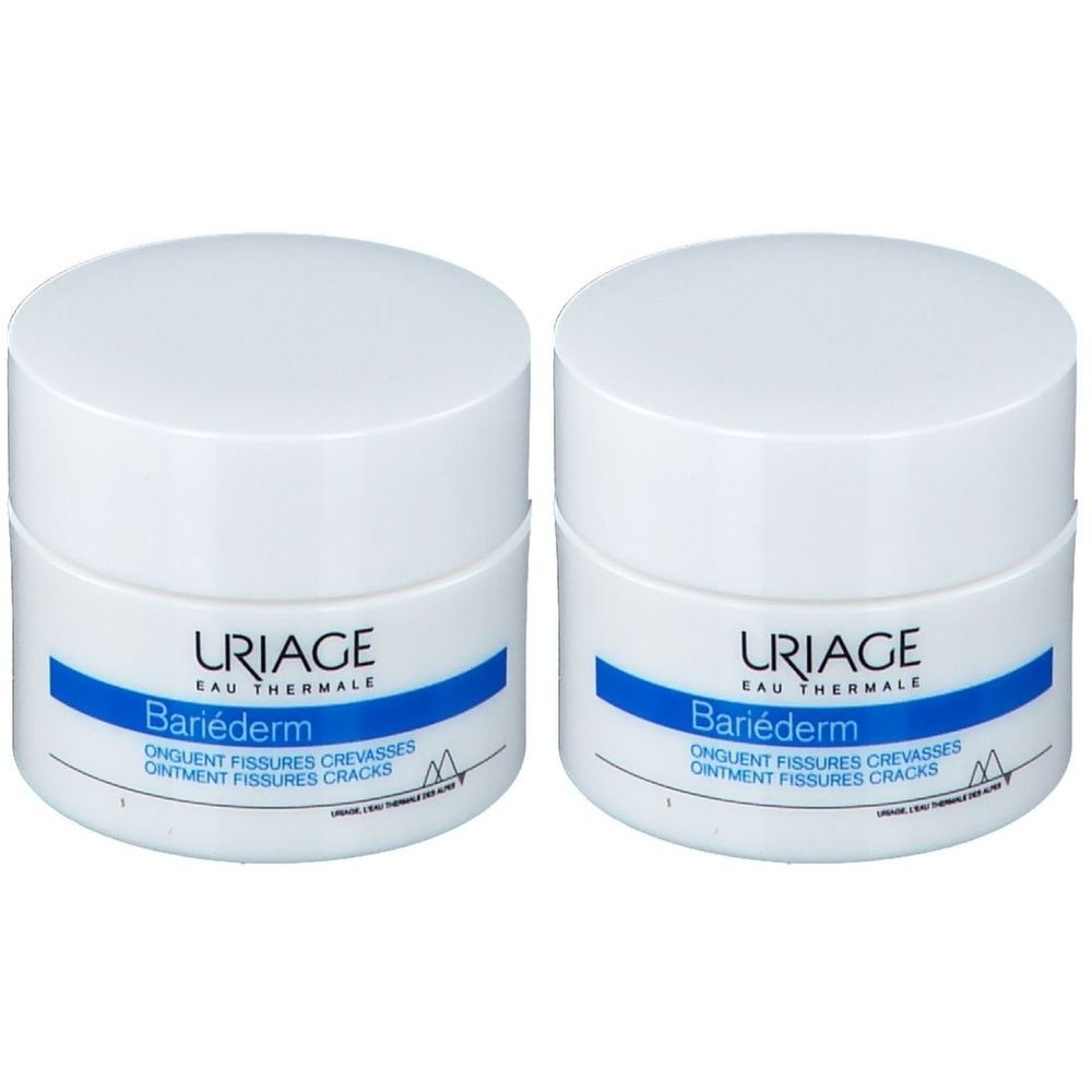Deux pots blancs avec couvercles. Étiquettes bleues avec "URIAGE Bariéderm".
