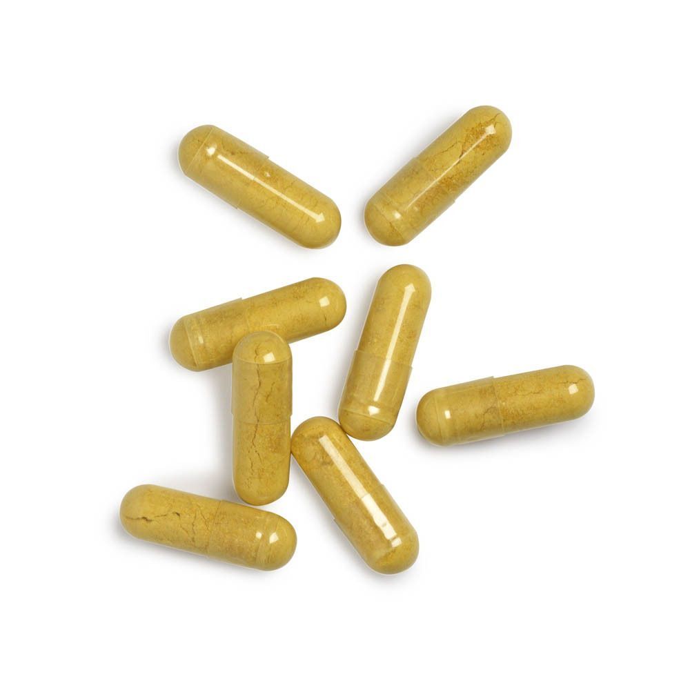Sept gélules jaunes Biotics Research CoQ-Zyme 100 Plus sur fond blanc.