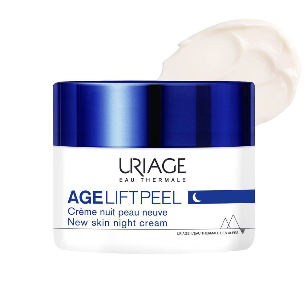Un pot de crème de nuit Uriage Age Lift Peel. Pot blanc avec couvercle bleu. Crème à côté.