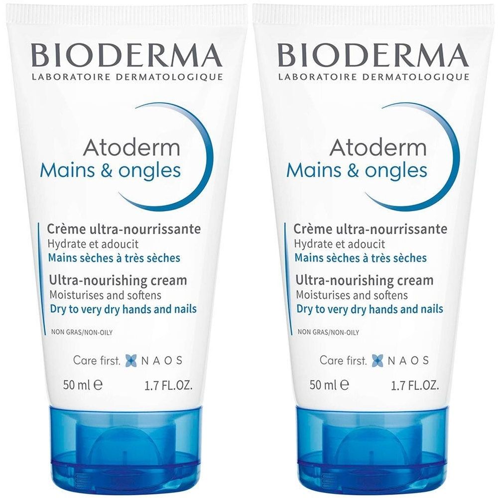 Deux tubes de crème pour les mains. Blanc avec texte et accents bleus. Inscription : BIODERMA, Atoderm Mains & ongles. 50 ml.