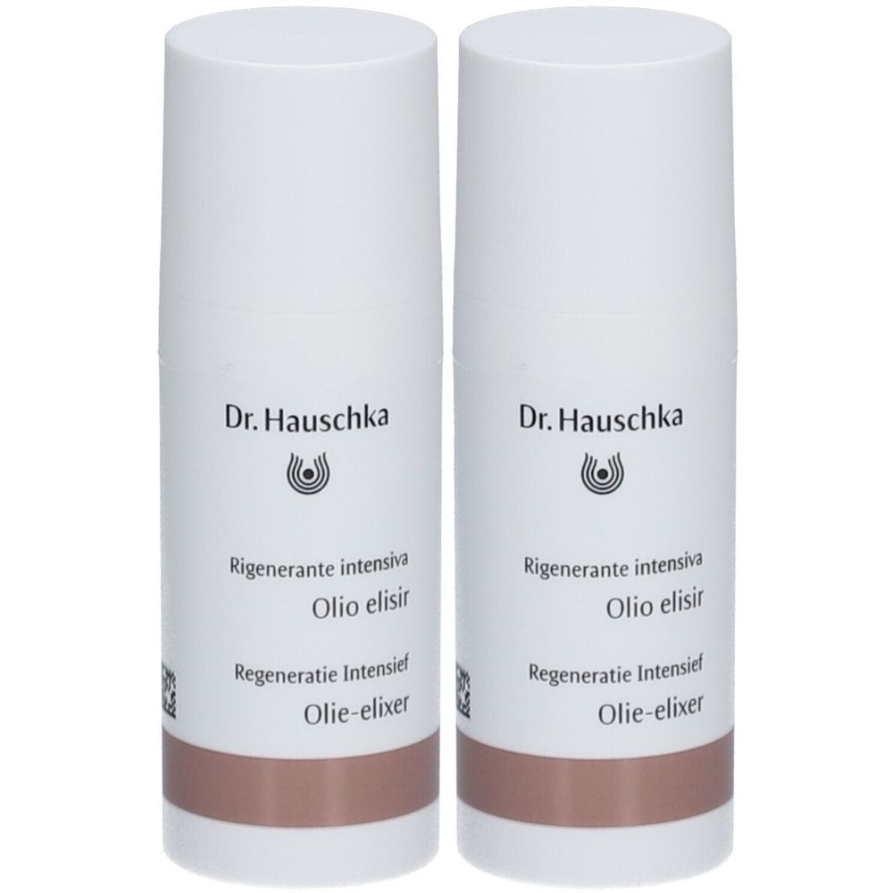 Deux flacons blancs avec une base marron. Chaque flacon porte la marque "Dr. Hauschka" et des inscriptions en plusieurs langues.