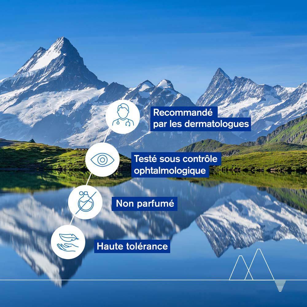 Paysage avec montagnes. Texte: Recommandé par les dermatologues, Testé sous contrôle ophtalmologique, Non parfumé, Haute tolérance.