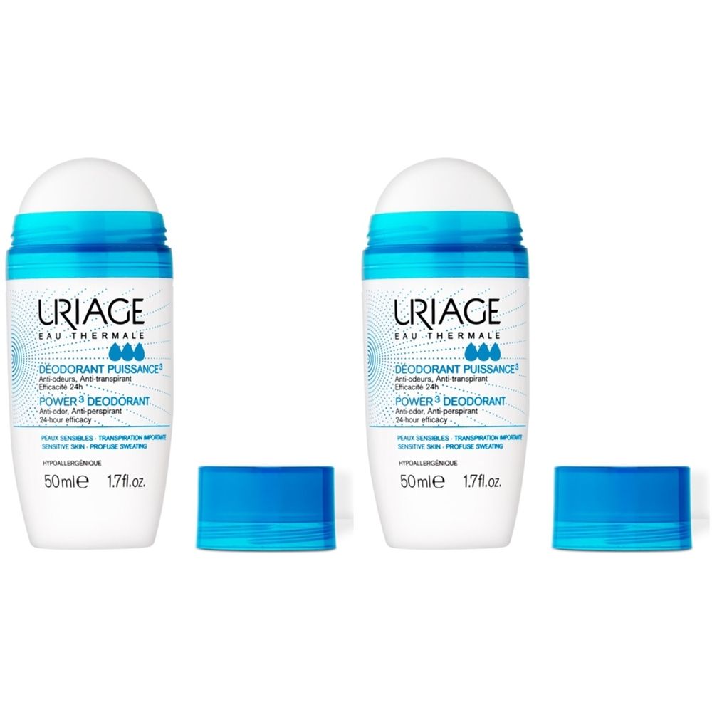 Deux déodorants roll-on blancs avec des détails bleus et des bouchons. Inscription: Uriage, Eau Thermale, Deodorant Puissance, Power Deodorant.