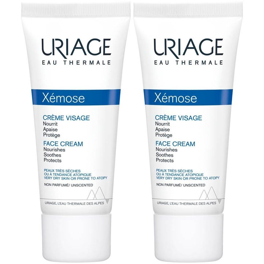 Deux tubes de crème visage Uriage Xémose. Tubes blancs avec bande bleue et texte. Inscription : Crème Visage, Face Cream.