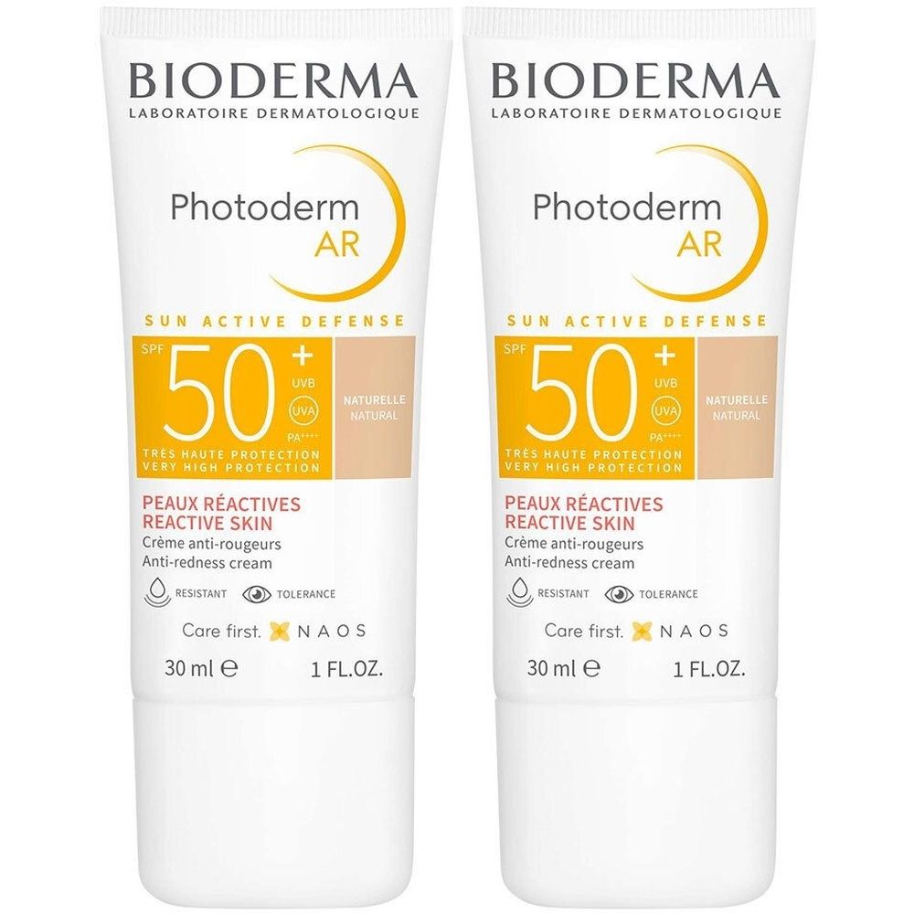 Deux tubes de BIODERMA Photoderm AR. Tubes blancs avec impression jaune. SPF 50. Texte : Peaux Réactives, Crème anti-rougeurs.