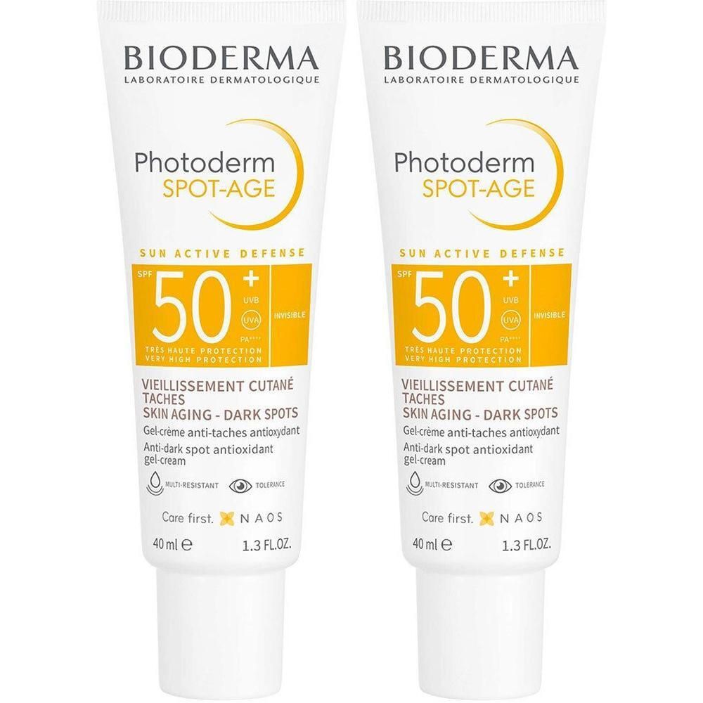 Deux tubes de Bioderma Photoderm Spot-Age SPF50+. Tubes blancs avec détails jaunes. Texte: SPF 50, Spot-Age, anti-âge.