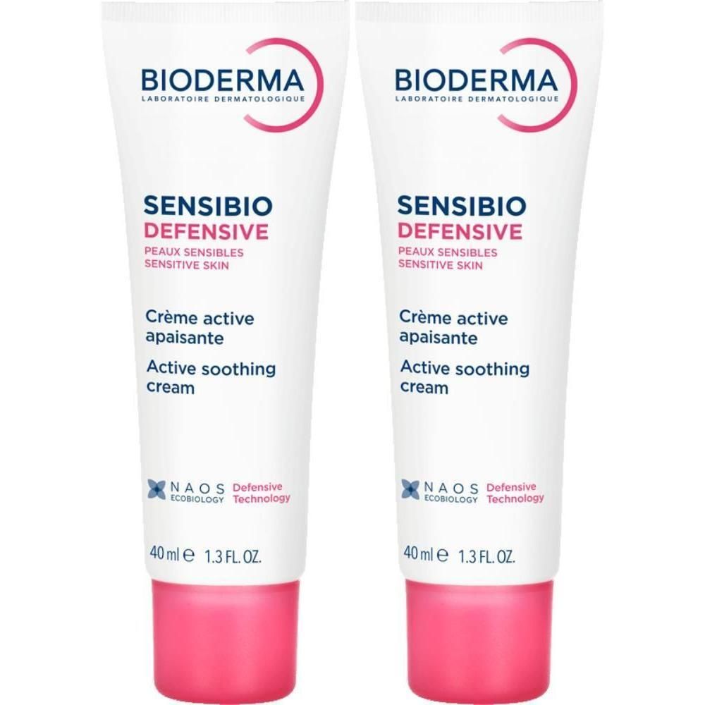 Deux tubes de crème Bioderma Sensibio Defensive. Blanc, accents roses. Texte: Sensibio Defensive, Active soothing cream.